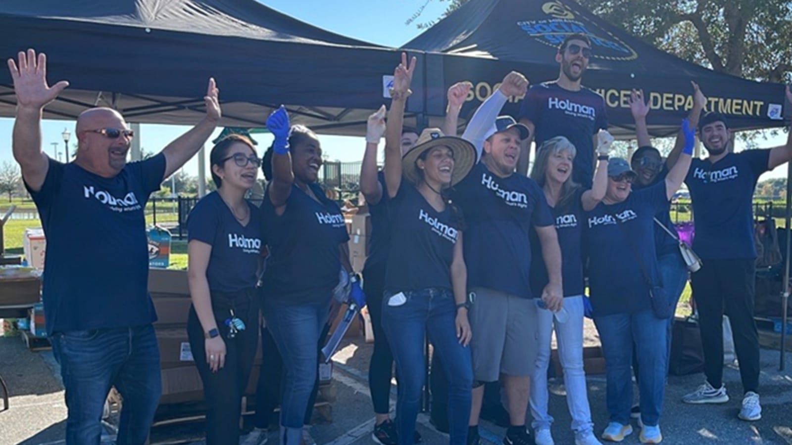 Holman team members volunteering together at a community event